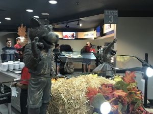 NC State's two mascots standing in the dining hall